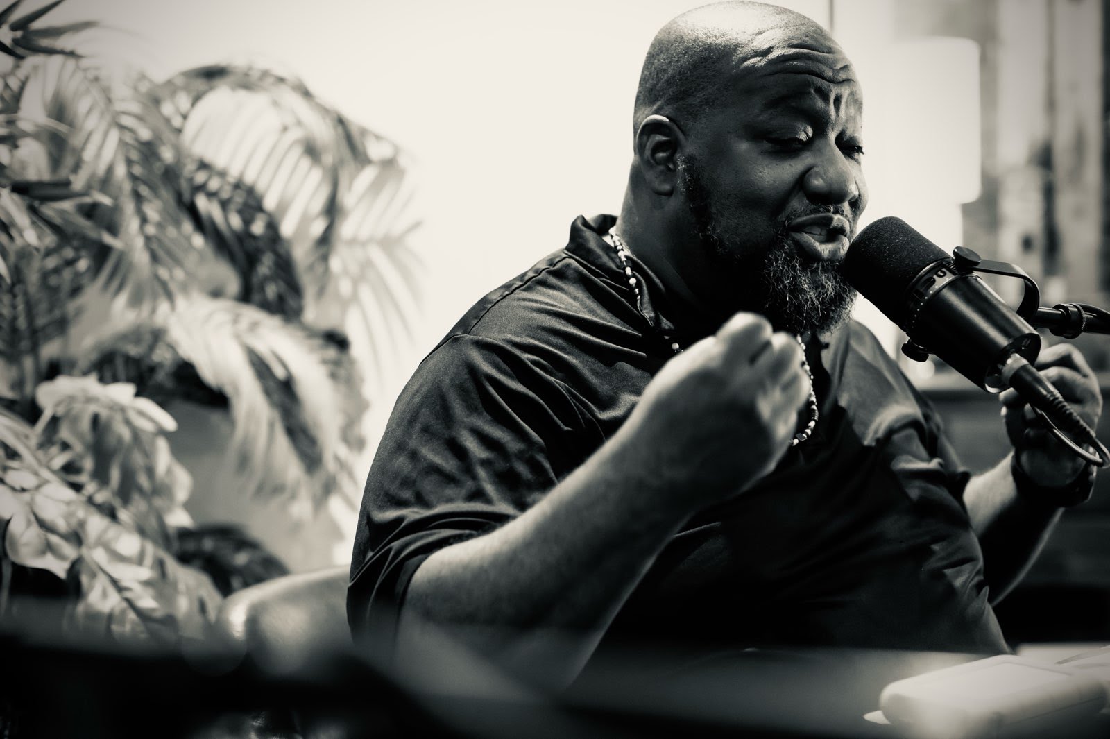 JR Byrd speaking into a studio microphone