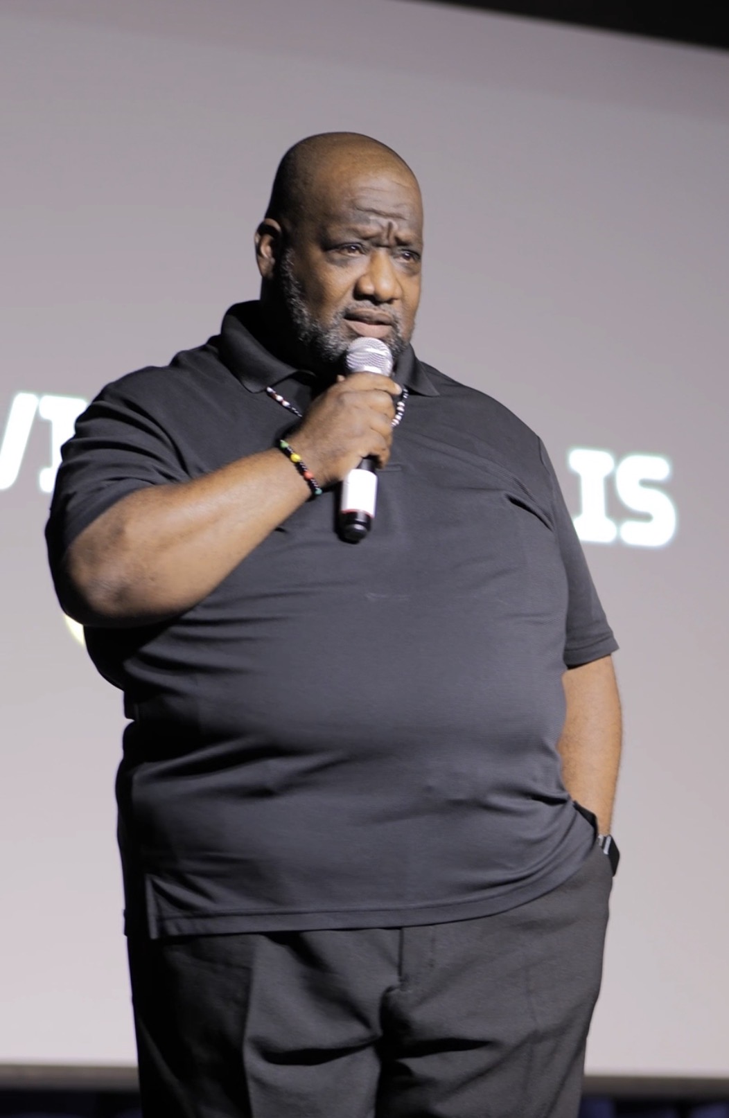J. Richard Byrd speaking with a handheld microphone